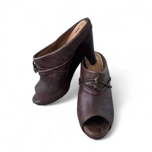 Anthropologie mules with wooden platform detail. Genuine leather upper 8.5